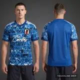 Model wearing Adidas x Corteiz Japan Anime Fusion Light Blue Concept Jersey, a Touchline Drip football x streetwear jersey