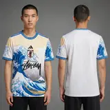 Model wearing Adidas x Stussy Japan Ocean Wave Concept Jersey, a Touchline Drip football x streetwear jersey