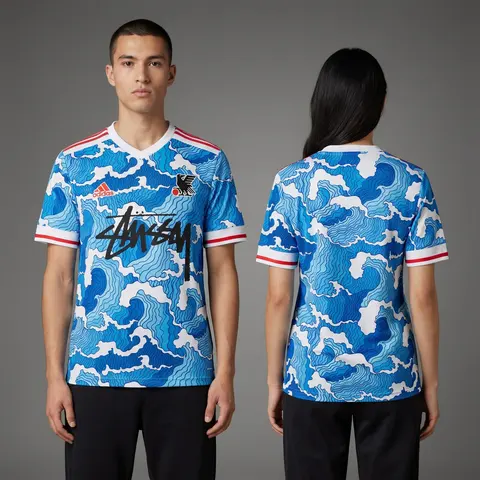 Model wearing Adidas x Stussy Japan Ocean Flow Concept Jersey - Blue Surge Edition, a Touchline Drip football x streetwear jersey