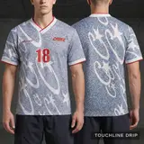 Model wearing Corteiz Grey Stellations Football Jersey, a Touchline Drip football x streetwear jersey