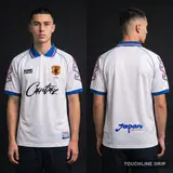 Model wearing Corteiz x Asics Japan 1998 Away Jersey, a Touchline Drip football x streetwear jersey