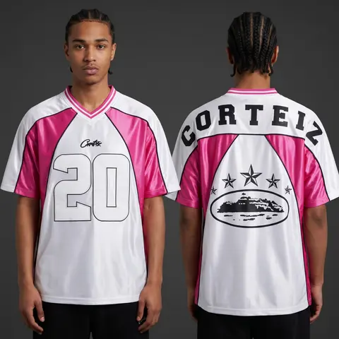 Model wearing Corteiz Fuchsia Fury 20 Jersey, a Touchline Drip football x streetwear jersey