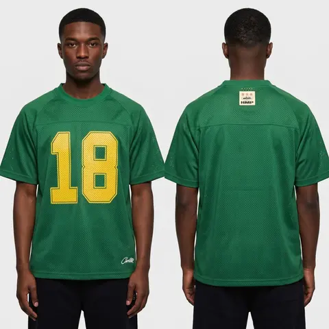 Model wearing Corteiz HMP Mesh Panel Jersey Green, a Touchline Drip football x streetwear jersey