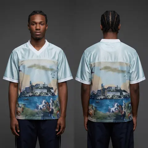 Model wearing Corteiz Narnia Football Jersey Blue/cream, a Touchline Drip football x streetwear jersey