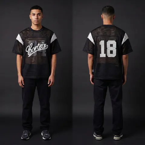Model wearing Corteiz Open Mesh Panel Jersey Black/white, a Touchline Drip football x streetwear jersey