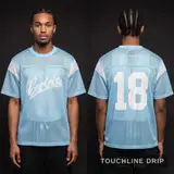 Model wearing Corteiz Open Mesh Panel Jersey 'baby Blue White', a Touchline Drip football x streetwear jersey
