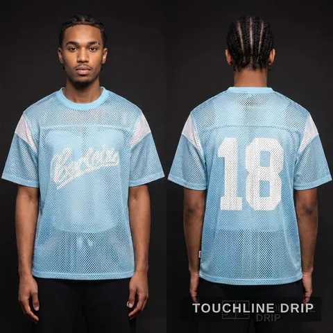 Model wearing Corteiz Open Mesh Panel Jersey 'baby Blue White', a Touchline Drip football x streetwear jersey