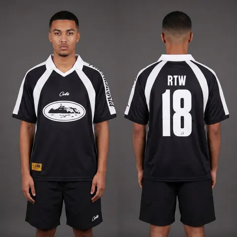 Model wearing Corteiz Black Alcatraz Jersey, a Touchline Drip football x streetwear jersey