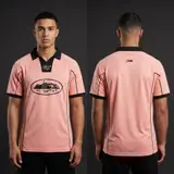 Model wearing Corteiz Pink Talismo Jersey, a Touchline Drip football x streetwear jersey