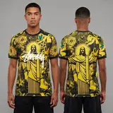 Model wearing Nike x Stussy Brazil Black and Yellow Christ the Redeemer Jersey, a Touchline Drip football x streetwear jersey