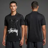 Model wearing Nike x Stussy Brazil 13/14 Blacked Out Jersey, a Touchline Drip football x streetwear jersey