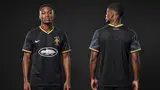 Model wearing Corteiz x Brazil Desert Breeze Alcatarz Concept Jersey, a Touchline Drip football x streetwear jersey