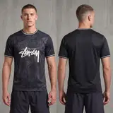 Model wearing Nike x Stussy Blacked Out Brazil Concept Jersey, a Touchline Drip football x streetwear jersey