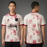 Model wearing Stussy x Japan Floral Cream Jersey, a Touchline Drip football x streetwear jersey