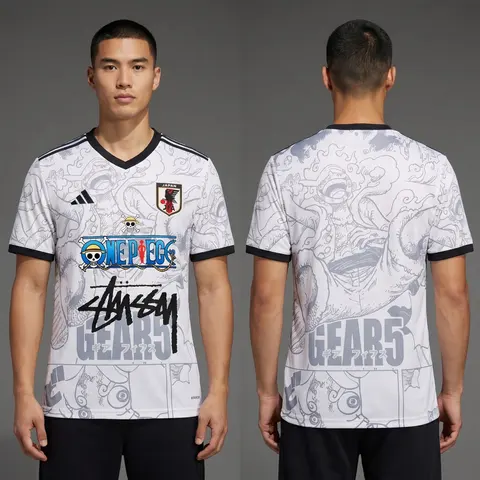 Model wearing Stussy x Japan One Piece White Jersey, a Touchline Drip football x streetwear jersey