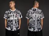 Model wearing Stussy x Japan "tokyo Streetscape" Concept Jersey – Grey, a Touchline Drip football x streetwear jersey