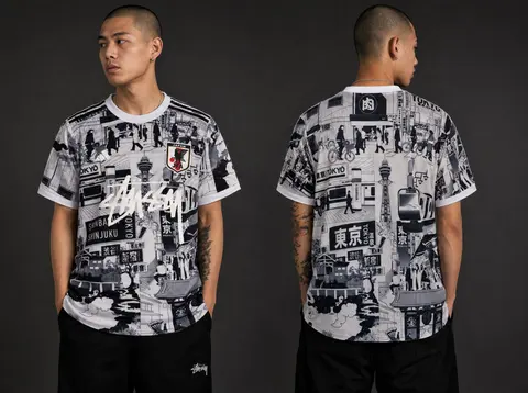Model wearing Stussy x Japan "tokyo Streetscape" Concept Jersey – Grey, a Touchline Drip football x streetwear jersey