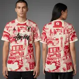 Model wearing Stussy x Japan "tokyo Streetscape" Concept Jersey – Red, a Touchline Drip football x streetwear jersey