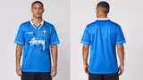 Model wearing Stussy x Umbro 96 Blue Away Jersey, a Touchline Drip football x streetwear jersey
