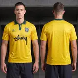 Model wearing Umbro x Stussy 1991 Brazil Home Jersey, a Touchline Drip football x streetwear jersey