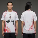 Model wearing Y-3 x Stussy x Japan "rising Phoenix" Limited Edition Jersey - White/red Flame, a Touchline Drip football x streetwear jersey