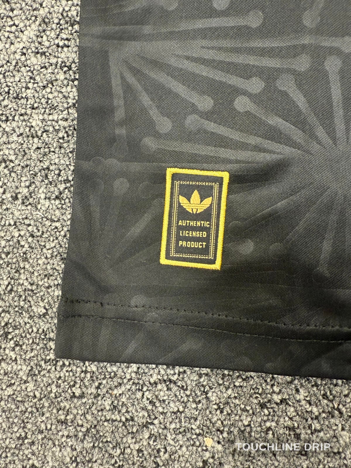 logo closeup product image of Adidas Mexico Anniversary Jersey - Black/gold - Limited Edition