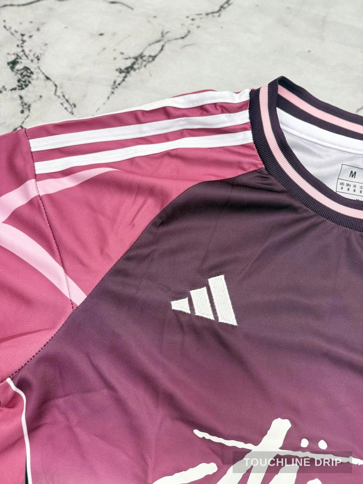 logo closeup product image of Adidas x Stussy Japan Sakura Bloom Concept Jersey