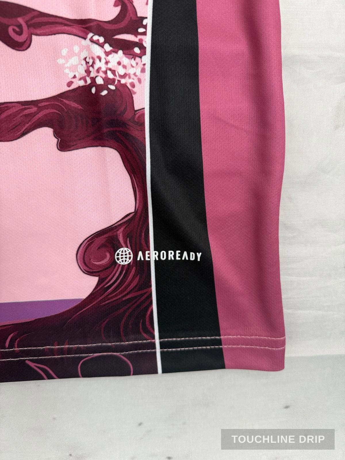 badge closeup product image of Adidas x Stussy Japan Sakura Bloom Concept Jersey