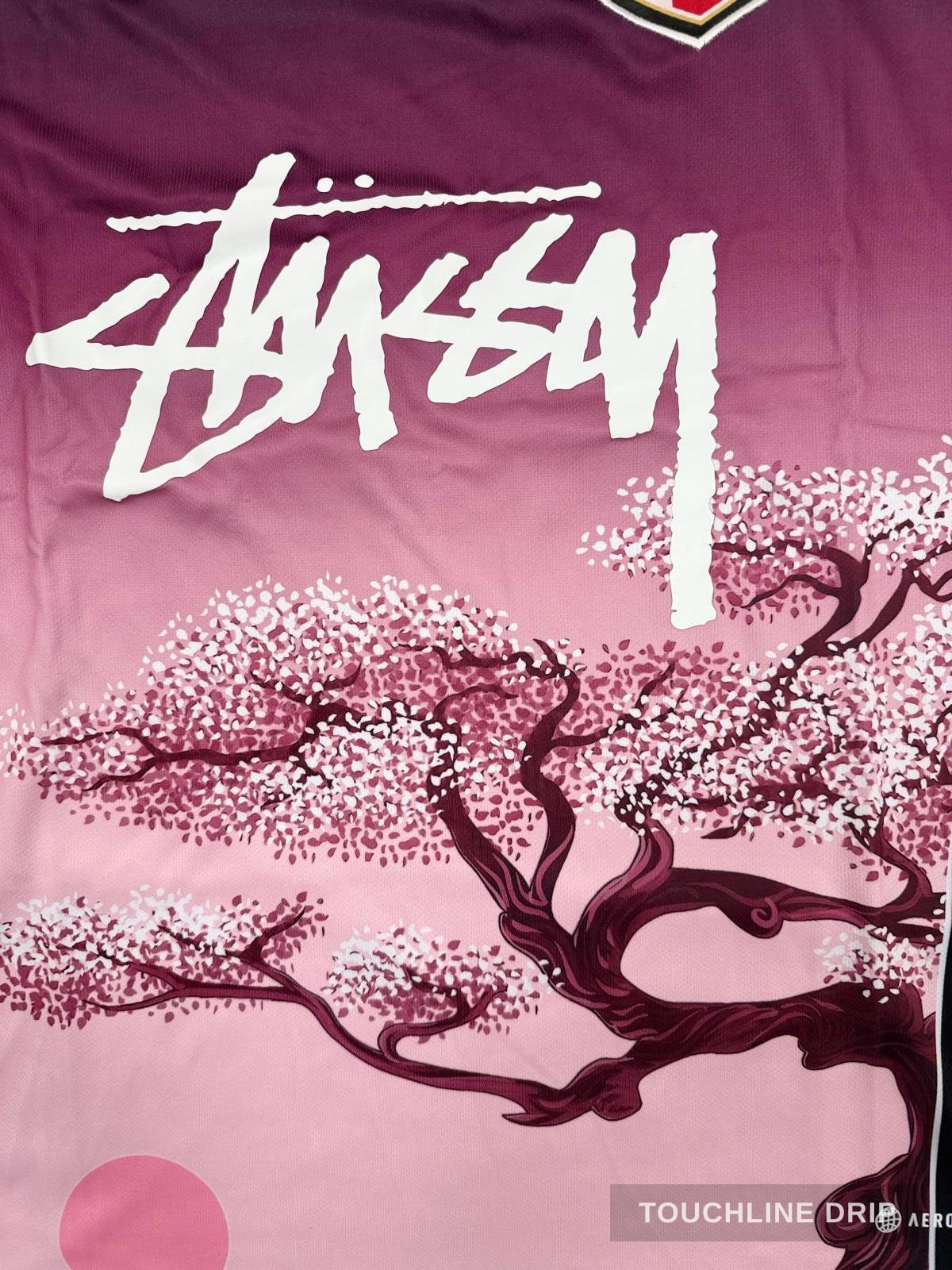 patch closeup product image of Adidas x Stussy Japan Sakura Bloom Concept Jersey