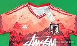 logo closeup detail image of Adidas x Stussy Japan Temple Serenity Concept Jersey - Crimson Dawn Edition