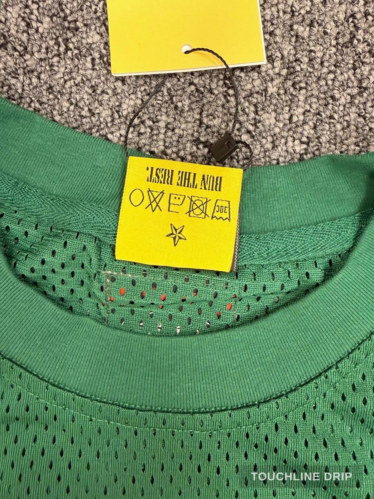 badge closeup product image of Corteiz HMP Mesh Panel Jersey Green