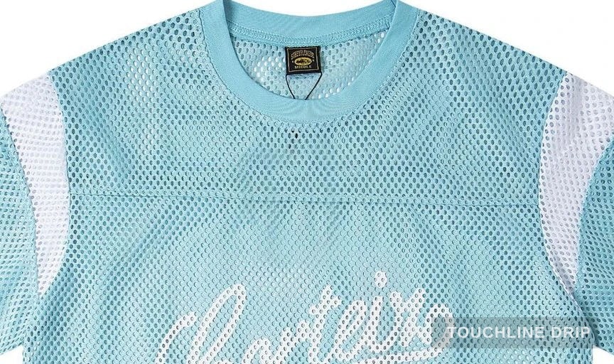 logo closeup detail image of Corteiz Open Mesh Panel Jersey 'baby Blue White'