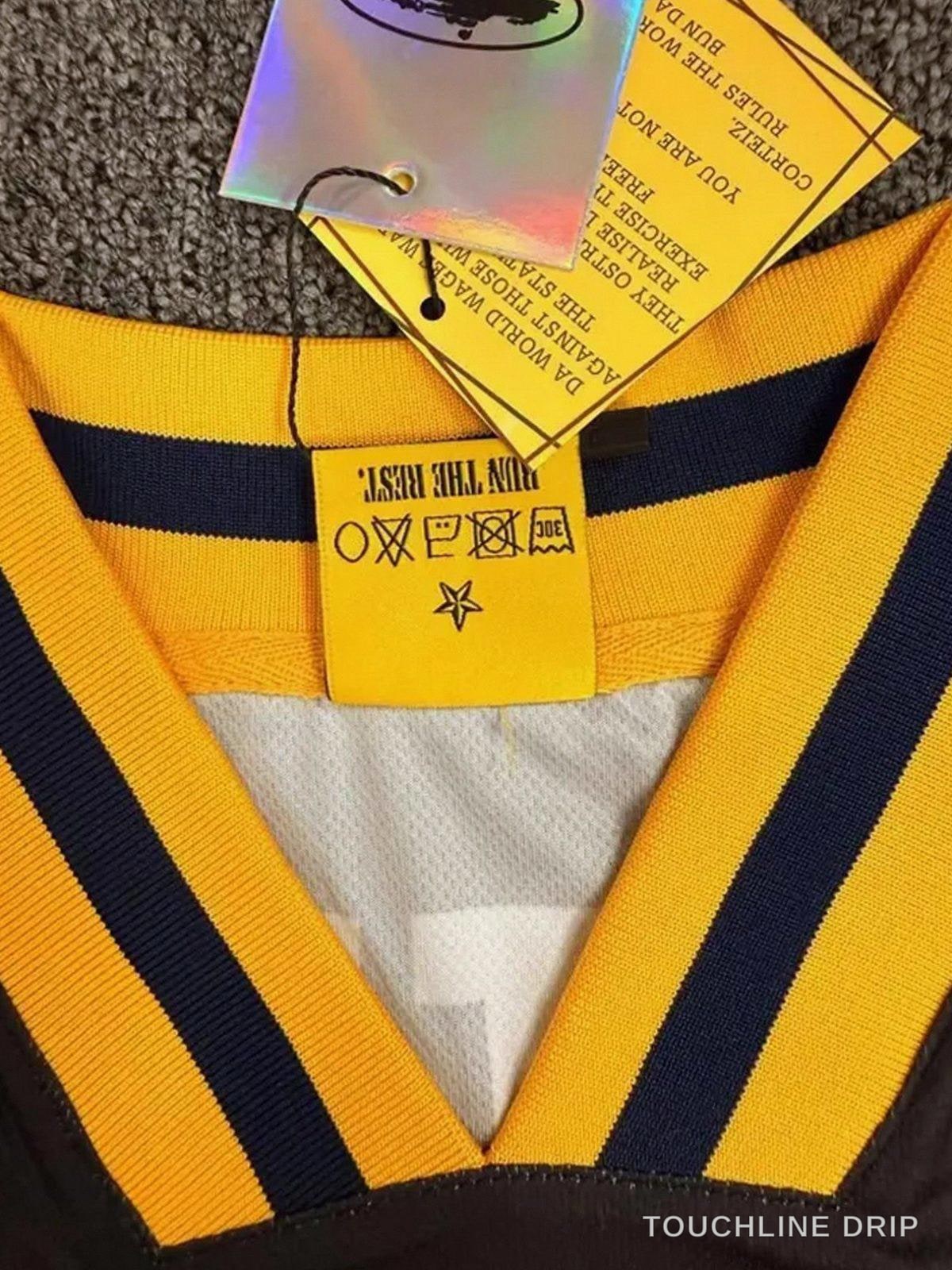 Sleeve and collar detail of Corteiz Club America Yellow Jersey