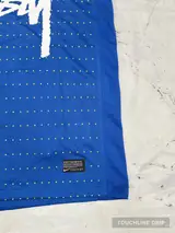 logo closeup product image of Nike x Stussy Brazil Dynamic Blue Concept Jersey