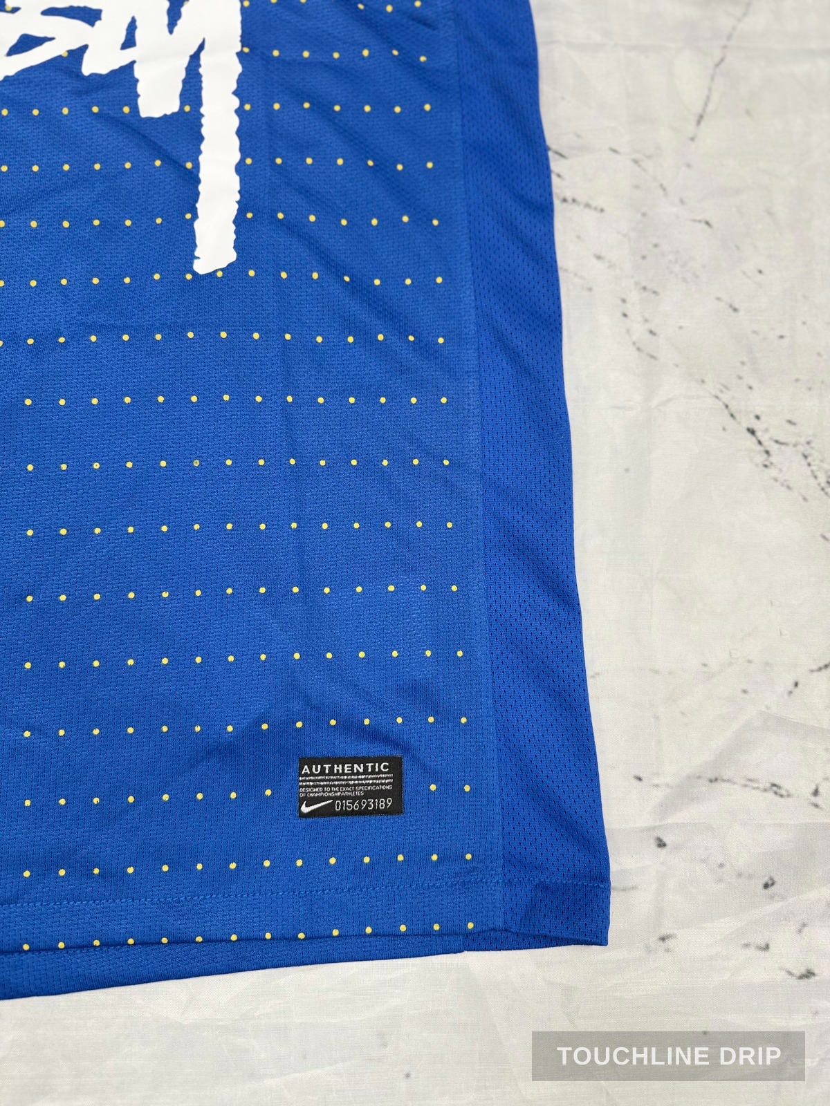 logo closeup product image of Nike x Stussy Brazil Dynamic Blue Concept Jersey