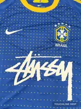 badge closeup product image of Nike x Stussy Brazil Dynamic Blue Concept Jersey