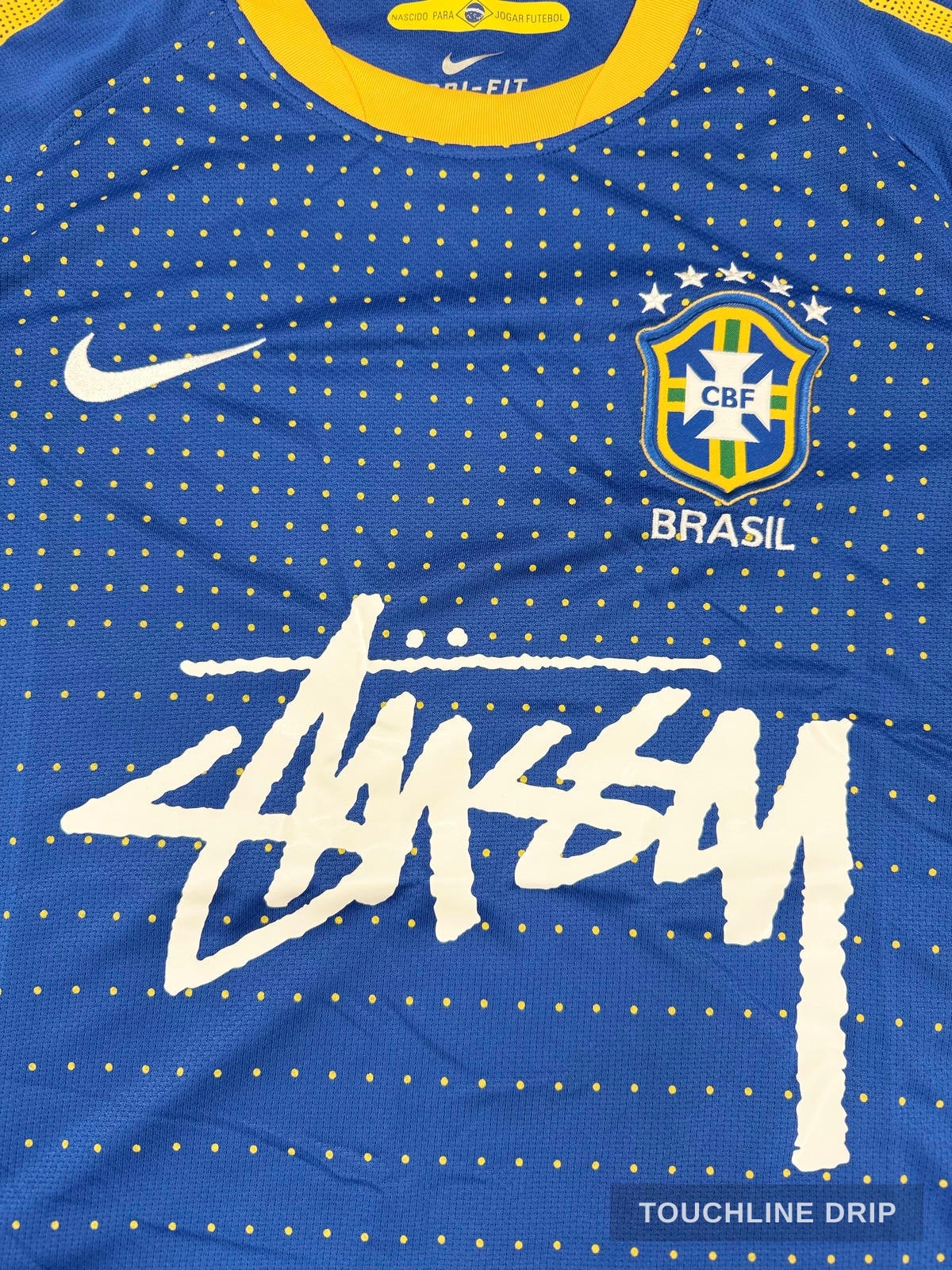 badge closeup product image of Nike x Stussy Brazil Dynamic Blue Concept Jersey
