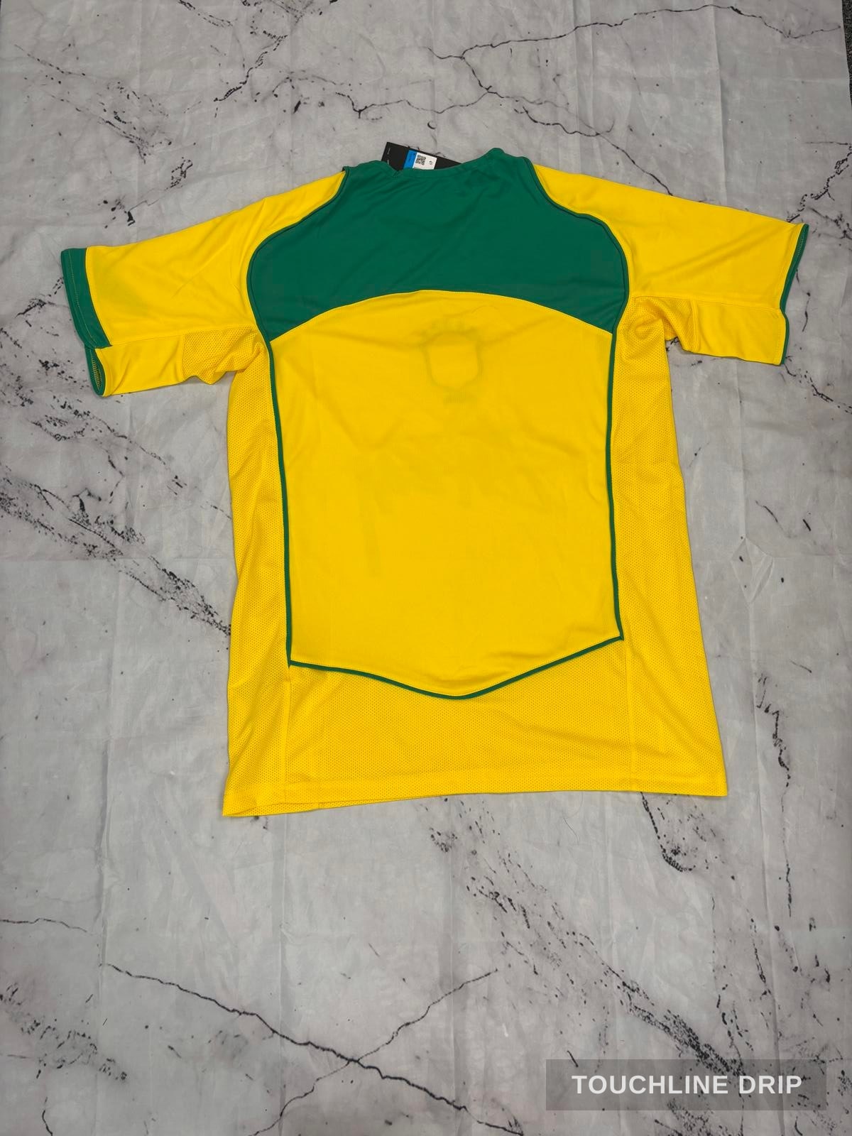 logo closeup product image of Nike x Stussy Brazil 2004 Home Jersey