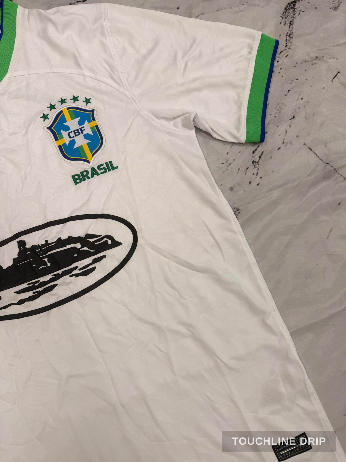 badge closeup product image of Nike x Corteiz Brazil White Leopard Concept Jersey