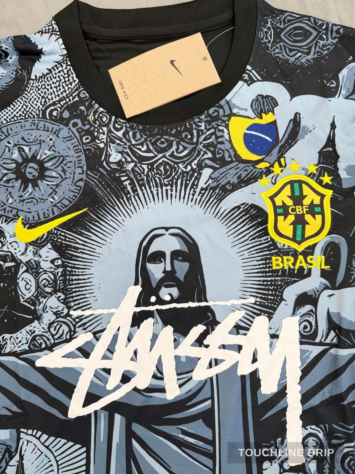logo closeup product image of Nike x Stussy Brazil Christ the Redeemer Concept Kit