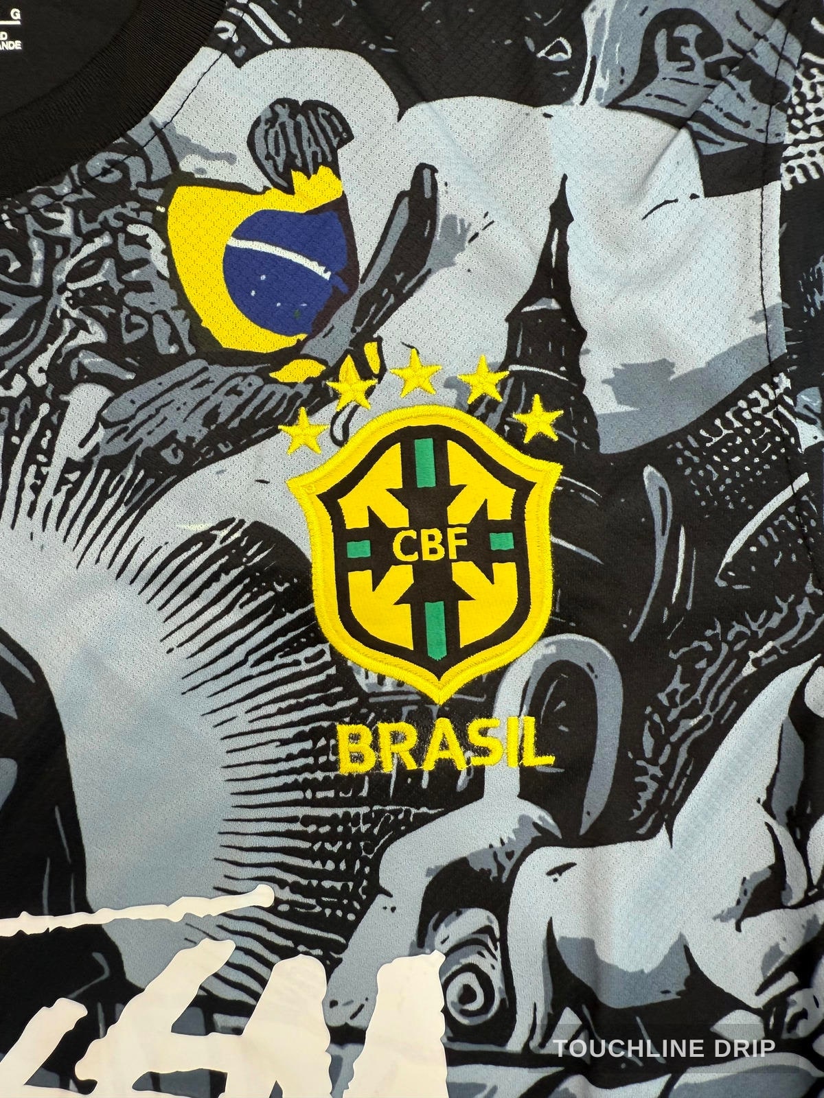 badge closeup product image of Nike x Stussy Brazil Christ the Redeemer Concept Kit