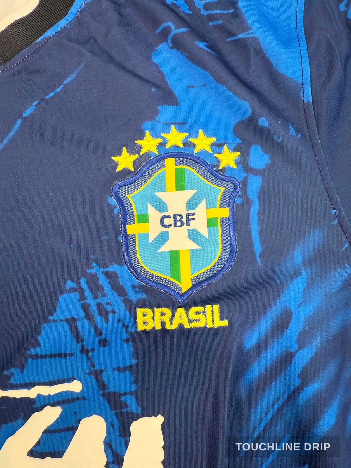badge closeup product image of Nike x Stussy Brazil Mid Blue Leaf Print Concept Jersey