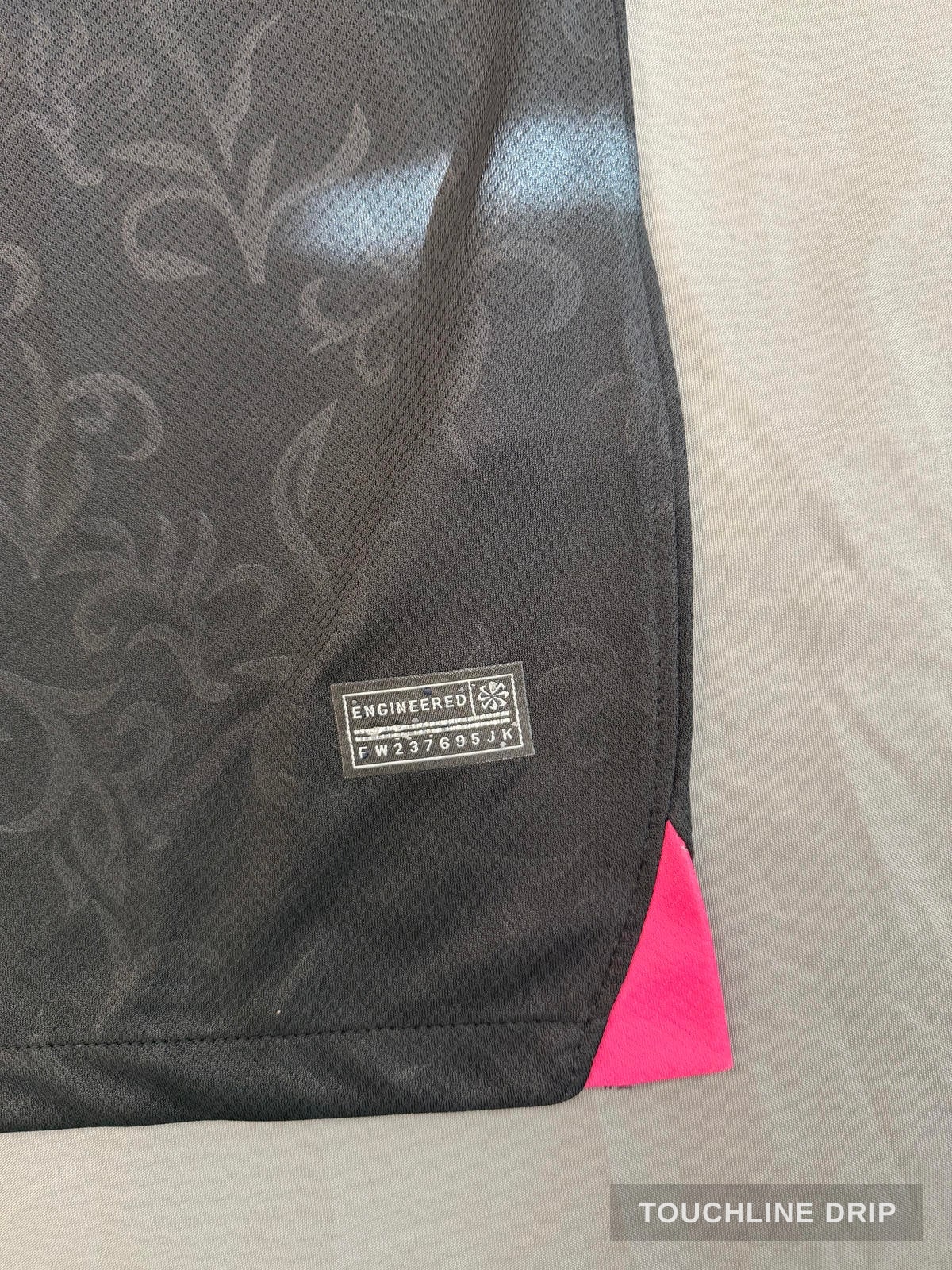 logo closeup product image of Nike x Stussy PSG GTO Black and Pink Jersey