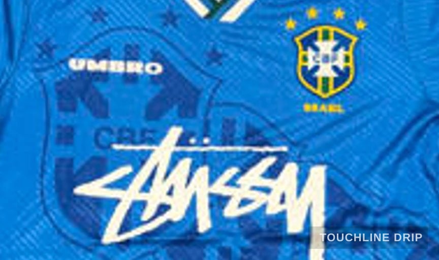 logo closeup detail image of Stussy x Umbro 96 Blue Away Jersey