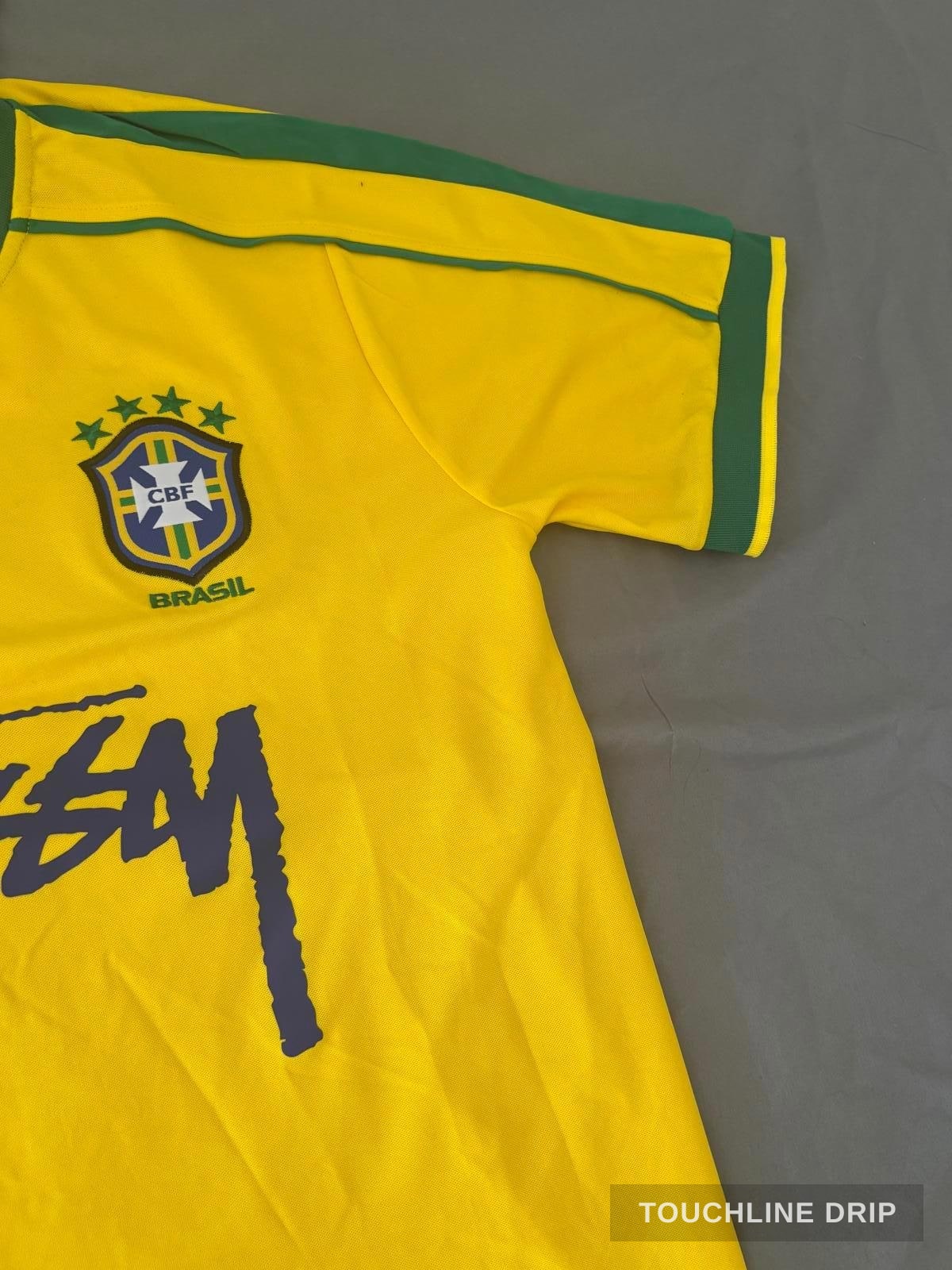 badge closeup product image of Nike x Stussy Brazil Yellow 1998 Inspired Special Edition Concept Jersey